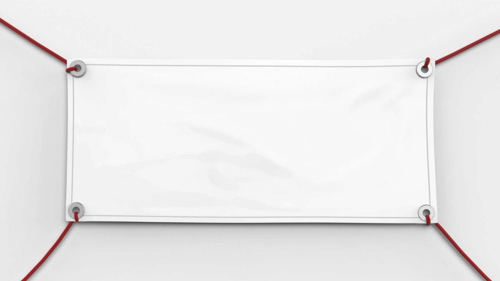A blank white banner is suspended by four red ropes, one at each corner. The banner is slightly wrinkled and centered against a plain white background. The ropes create a rectangular frame around the banner.